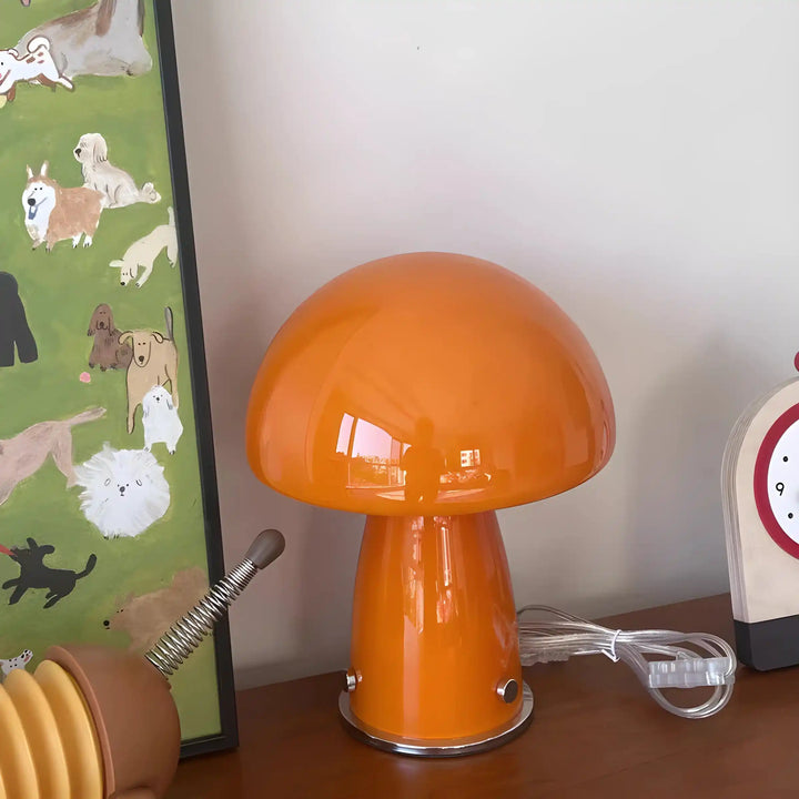 Orange mushroom-shaped table lamp with a glossy finish.