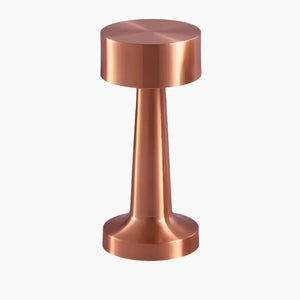 Copper-colored metallic tamper with a cylindrical handle and flat circular base.