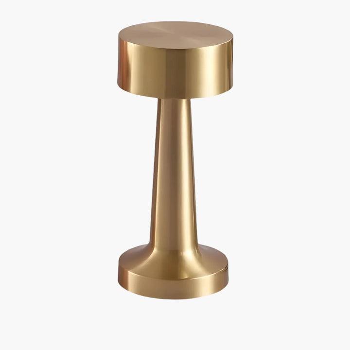 Gold-colored metal door knob or handle with a cylindrical shape and flat top.