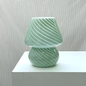 Mint green glass lamp with spiral pattern.