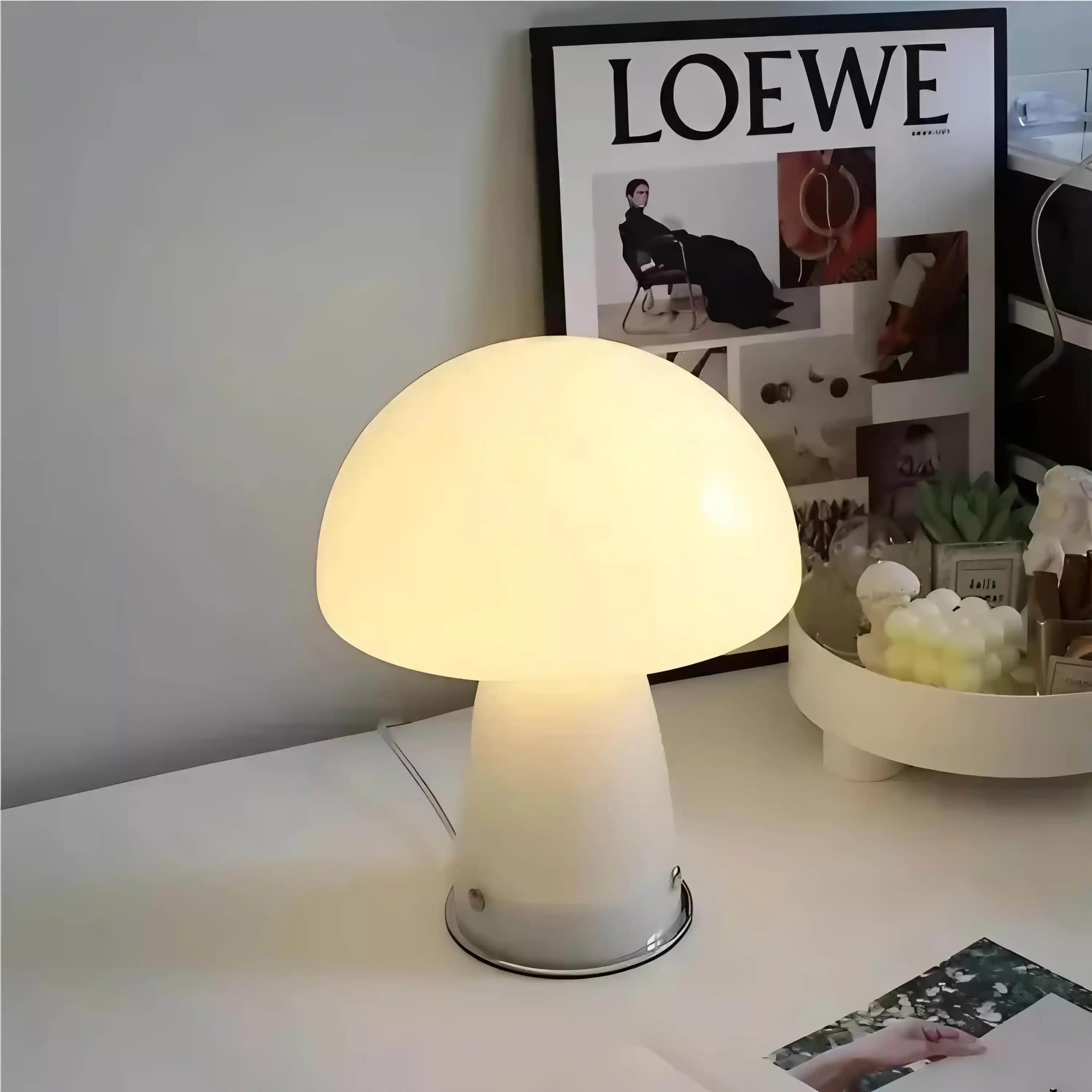 Illuminated mushroom-shaped table lamp with a frosted glass shade.