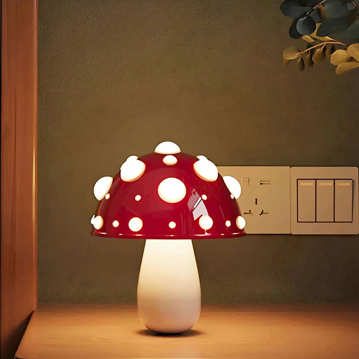 Mushroom-shaped lamp with a red and white spotted cap.