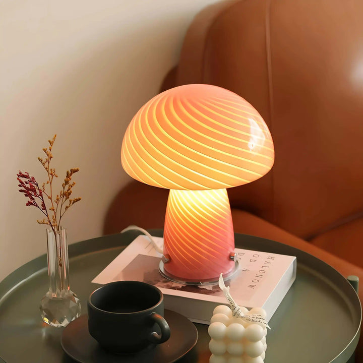 Glowing mushroom-shaped lamp with a swirled pattern on its dome.