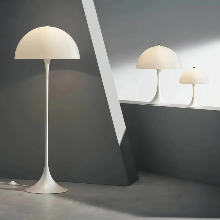 Mushroom-shaped floor lamp with a white dome shade and slender stem.